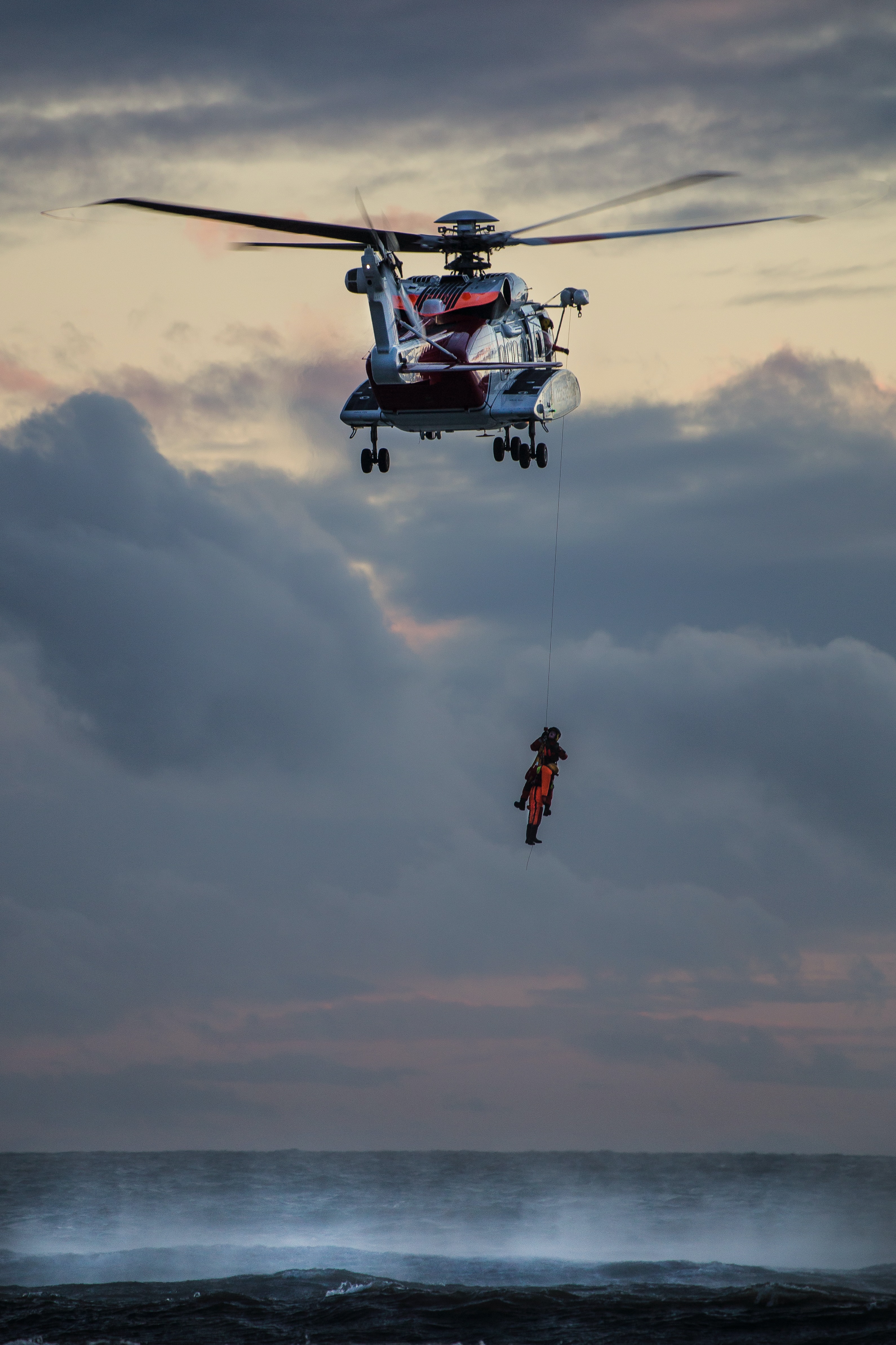 Paramedic get winched into the water